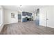 Light and airy dining area with wood-look floors and modern kitchen view at 6526 W Devonshire Ave, Phoenix, AZ 85033