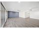 Bright living room with hardwood floors and a wall accent at 6526 W Devonshire Ave, Phoenix, AZ 85033