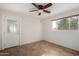 Bedroom with tile floors, ceiling fan, and exterior access at 6816 E Oak St, Scottsdale, AZ 85257