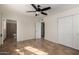 Bedroom with tile floors, ceiling fan, and private bathroom at 6816 E Oak St, Scottsdale, AZ 85257