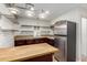 Well-equipped kitchen featuring stainless steel appliances and wood cabinets at 6816 E Oak St, Scottsdale, AZ 85257