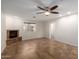 Bright living room featuring tile floors and a fireplace at 6816 E Oak St, Scottsdale, AZ 85257