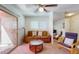 Living room with a brown couch and access to patio at 7430 E Chaparral Rd # A129, Scottsdale, AZ 85250