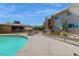 Community pool with surrounding patio and building views at 7430 E Chaparral Rd # A129, Scottsdale, AZ 85250