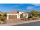 Single story home with desert landscaping and two car garage at 814 E Fruit Stand Way, Queen Creek, AZ 85140