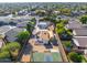 Aerial view of house, basketball court, and surrounding area at 8340 E Thomas Rd, Scottsdale, AZ 85251