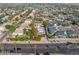 Aerial view of house, street, and surrounding neighborhood at 8340 E Thomas Rd, Scottsdale, AZ 85251