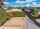 Aerial view showing driveway and landscaping at 8340 E Thomas Rd, Scottsdale, AZ 85251