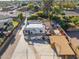 Aerial view of a home with a large backyard and detached garage at 8340 E Thomas Rd, Scottsdale, AZ 85251