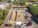 Aerial view of house, basketball court and surrounding neighborhood at 8340 E Thomas Rd, Scottsdale, AZ 85251