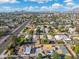 Aerial view of a residential neighborhood with houses, roads, and lush landscaping at 8340 E Thomas Rd, Scottsdale, AZ 85251