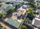 Aerial view showing a home, pool, and basketball court at 8340 E Thomas Rd, Scottsdale, AZ 85251