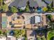 Aerial view showing house, pool, and basketball court at 8340 E Thomas Rd, Scottsdale, AZ 85251