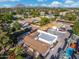 Aerial view of a house with a pool, basketball court, and large backyard at 8340 E Thomas Rd, Scottsdale, AZ 85251