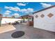 Flagstone patio with fire pit and outdoor kitchen area at 8340 E Thomas Rd, Scottsdale, AZ 85251