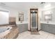 Bathroom with a walk-in shower and double vanity at 8340 E Thomas Rd, Scottsdale, AZ 85251
