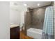 Clean bathroom with tub, shower, and updated tile at 8340 E Thomas Rd, Scottsdale, AZ 85251