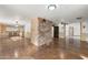 Open dining area with stone accent wall and tile floor at 8340 E Thomas Rd, Scottsdale, AZ 85251