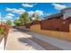 Long driveway with decorative walls and landscaping at 8340 E Thomas Rd, Scottsdale, AZ 85251