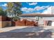 View of the property's unique metal gate at 8340 E Thomas Rd, Scottsdale, AZ 85251