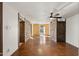 Long hallway with stone feature wall and tile floors at 8340 E Thomas Rd, Scottsdale, AZ 85251