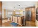 Island kitchen with stainless steel appliances and granite at 8340 E Thomas Rd, Scottsdale, AZ 85251