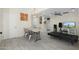 Open living area with a comfortable daybed and dining space at 8340 E Thomas Rd, Scottsdale, AZ 85251