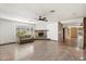 Spacious living room features a fireplace and tile floors at 8340 E Thomas Rd, Scottsdale, AZ 85251
