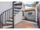 Metal spiral staircase with access to a private area at 8340 E Thomas Rd, Scottsdale, AZ 85251