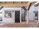 Exterior spiral staircase leading to an upper level at 8340 E Thomas Rd, Scottsdale, AZ 85251