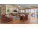 Gathering room with tile floors, stone accent wall, and sliding glass doors at 10610 E Carol Ave, Mesa, AZ 85208