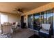 Relaxing patio with seating area and sliding glass doors at 11046 N 28Th Dr # 242, Phoenix, AZ 85029