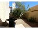 Small backyard with gravel and a gas grill at 11059 E Yucca St, Scottsdale, AZ 85259