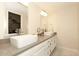 Bathroom with double sinks and a large vanity at 11059 E Yucca St, Scottsdale, AZ 85259