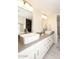 Bathroom with double sinks, large vanity, and a separate shower at 11059 E Yucca St, Scottsdale, AZ 85259