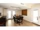 Bright dining room features a wood table with chairs and access to a patio at 11059 E Yucca St, Scottsdale, AZ 85259