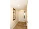 Light and bright entryway with wood-look floors and artwork at 11059 E Yucca St, Scottsdale, AZ 85259