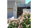 Two-story home with gated entry and blooming pink flowers at 11059 E Yucca St, Scottsdale, AZ 85259