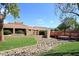 Community building with red bridge, landscaping, and mountain views at 11059 E Yucca St, Scottsdale, AZ 85259