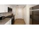 Modern kitchen with white cabinets, stainless steel appliances, and a pantry at 11059 E Yucca St, Scottsdale, AZ 85259
