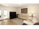 Living room with comfortable seating, large TV and hardwood floors at 11059 E Yucca St, Scottsdale, AZ 85259