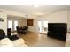 Open living and dining area with hardwood floors and patio access at 11059 E Yucca St, Scottsdale, AZ 85259