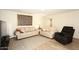 Living room with two sofas, recliner, and hardwood flooring at 11059 E Yucca St, Scottsdale, AZ 85259