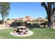 Stone patio furniture in front of community building at 11059 E Yucca St, Scottsdale, AZ 85259