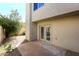 Small concrete patio with double doors access at 11059 E Yucca St, Scottsdale, AZ 85259