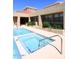 Community pool and spa with building in background at 11059 E Yucca St, Scottsdale, AZ 85259