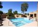 Community pool and spa with surrounding landscaping at 11059 E Yucca St, Scottsdale, AZ 85259