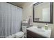 Bathroom with shower/tub combo, vanity, and linen shelf at 11337 E Elena Ave, Mesa, AZ 85208