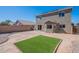 Large backyard with artificial turf and a patio area at 13309 N 124Th Ave, El Mirage, AZ 85335