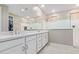 Modern bathroom with double vanity, large mirror, and walk-in shower at 13930 W Tierra Grande --, Surprise, AZ 85387